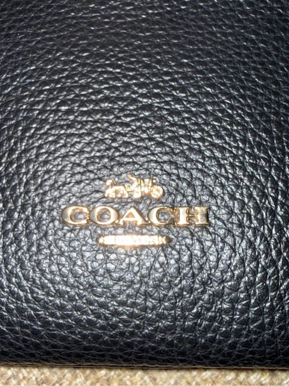 Coach Double Zip Wristlet crafted in black pebbled leather